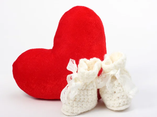 Heart and baby's bootee — Stock Photo, Image