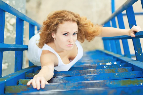 Businesswoman posing over old factory — Stock Photo, Image