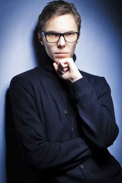 stock image Young man wearing elegant black pullover and glasses