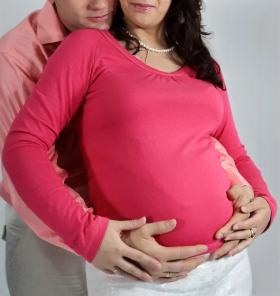 Married couple holding the belly — Stock Photo, Image