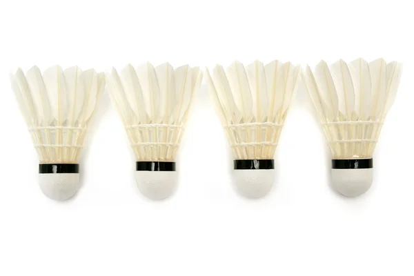 Four white badminton shuttlecocks — Stock Photo, Image