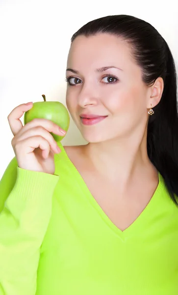 Gyönyörű fiatal nő, egy zöld alma — Stock Fotó