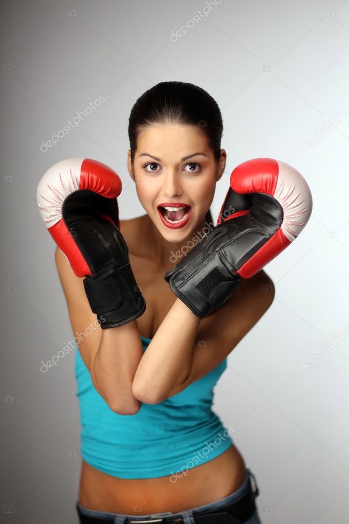 Young beautiful women wiht boxing gloves. — Stock Photo © tolikm #4159328