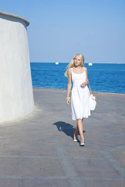 stock image Beautiful woman resting in park near the sea