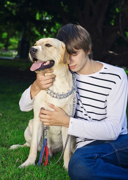 Young man with dog — Stock Photo, Image