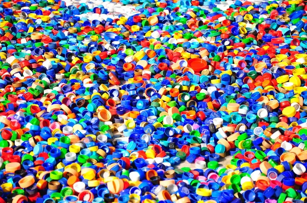Újrahasznosított műanyag palack kupak készült háttér — Stock Fotó