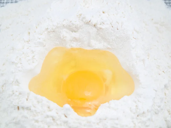Egg in a flour — Stock Photo, Image