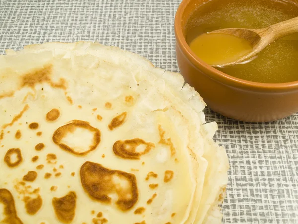 Pancakes near honey — Stock Photo, Image