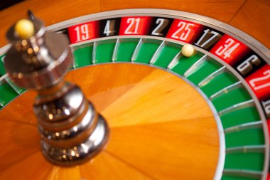 closeup shot of casino roulette spinning with ball on 17 clipart