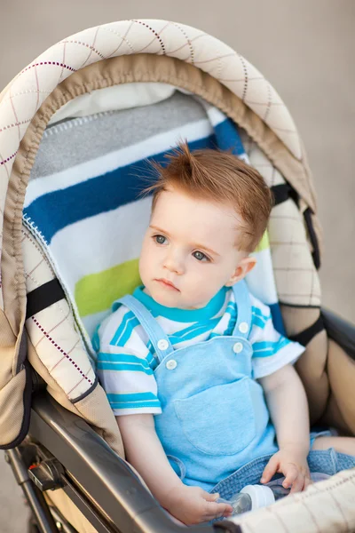 Boy in baby carriage — Stock Photo, Image