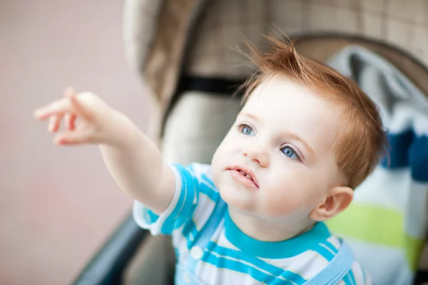 Caucasian Year Old Boy Sitting Baby Carriage Pointing Finger Something — Stock Photo, Image