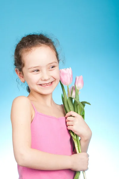 Little girl with tulips — Stock Photo, Image