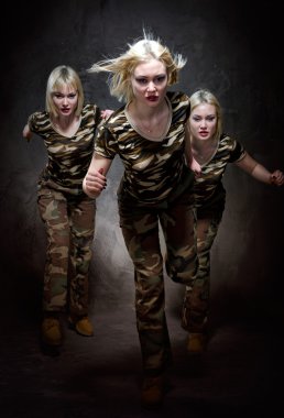 Running military women isolated on black background clipart