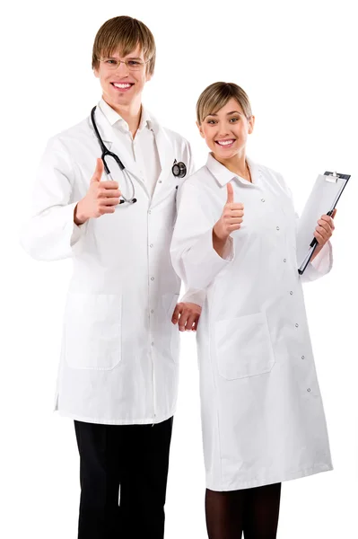 Zadowolony mężczyzna i kobieta lekarze z kciuki — Zdjęcie stockowe