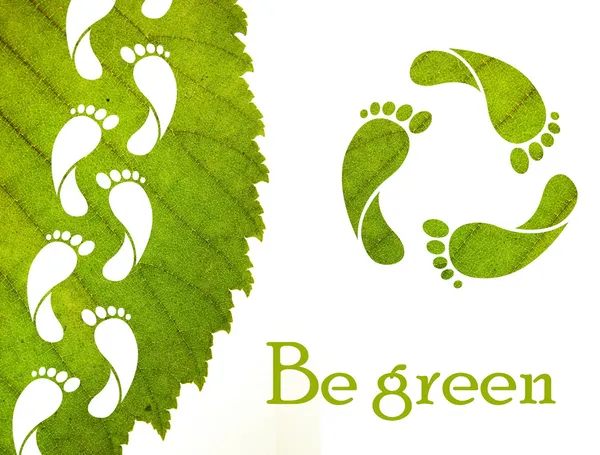 Lábnyom recycle jel és a zöld leveles — Stock Fotó