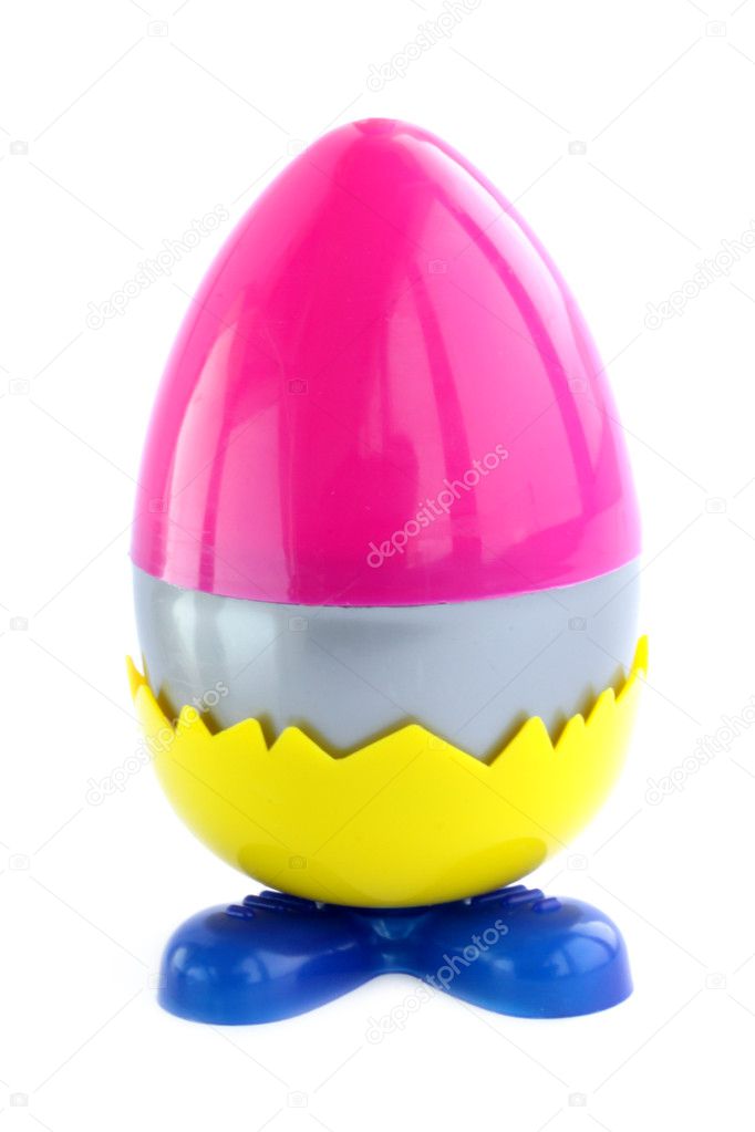 Plastic, many-colored Easter egg against the white background
