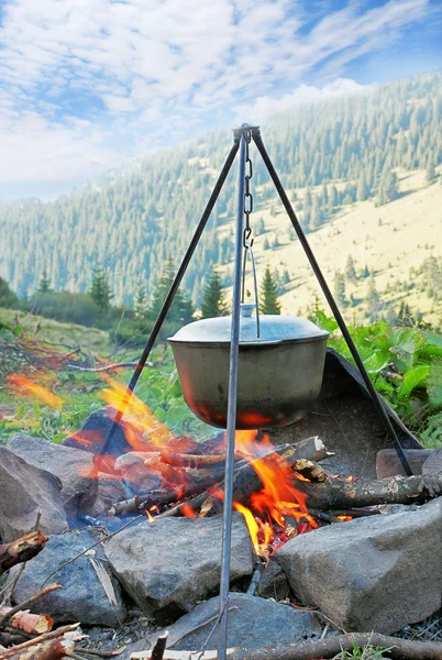 stock image Preparation of food in the large kettle on nature