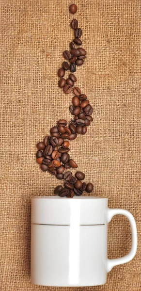 Koffie graan op de textiel — Stockfoto