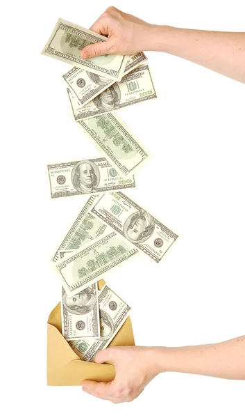 Mão e dinheiro caindo no envelope — Fotografia de Stock