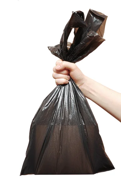 Kadın el siyah çöp torbasına — Stok fotoğraf