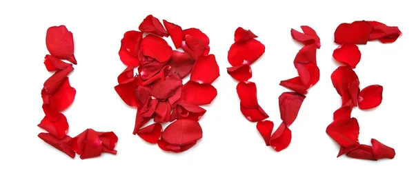 Slovo "láska" vyrobeno z plátku červené růže — Stock fotografie
