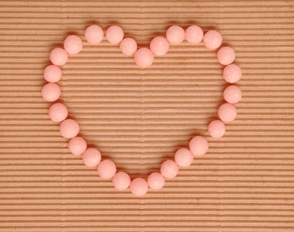 Beautiful sweet candies in heart shape — Stock Photo, Image