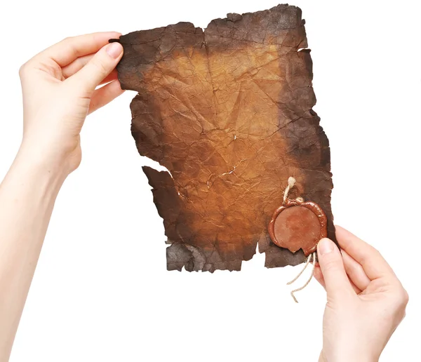 Old paper with a stamp in the hands — Stock Photo, Image