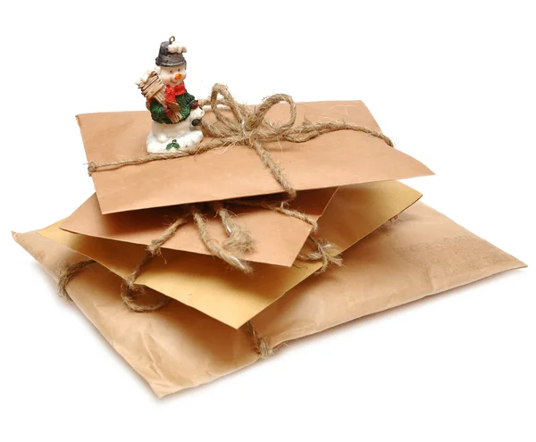 A pile of parcels and snowman — Stock Photo, Image