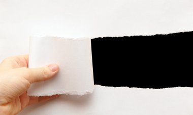 Torn paper with space for text with black background clipart