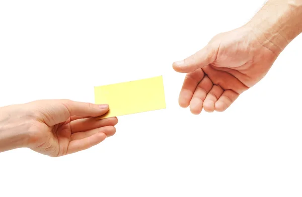 Vrouw hand passeert blanco visitekaartje — Stockfoto