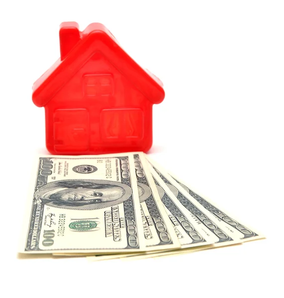 Casa em cima de um dinheiro — Fotografia de Stock