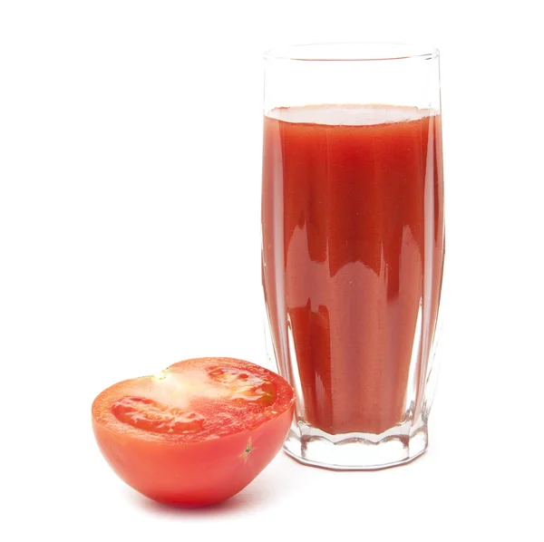 Fresh tomatoes and a glass full of tomato juice — Stock Photo, Image