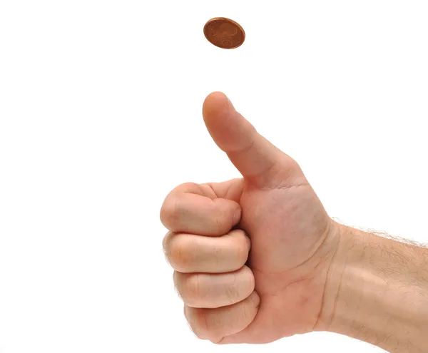 La mano del hombre vomitando una moneda para tomar una decisión — Foto de Stock