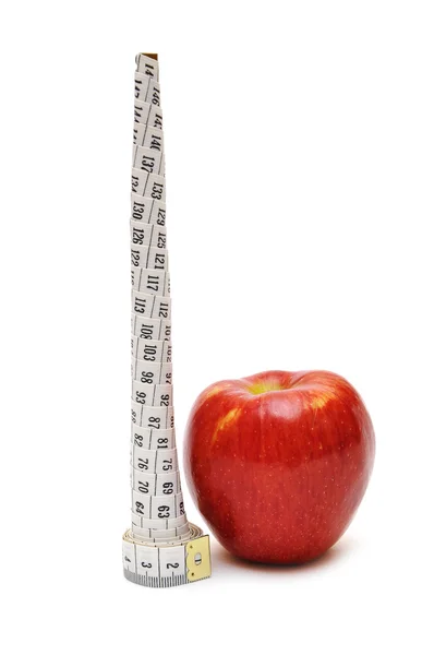Red apple and tape measure close up — Stock Photo, Image