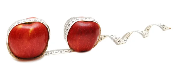 Red apple and tape measure close up — Stock Photo, Image
