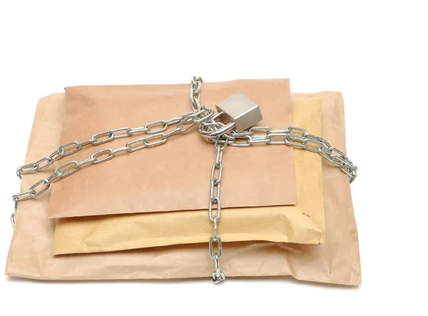 Parcel wrapped in a chain — Stock Photo, Image