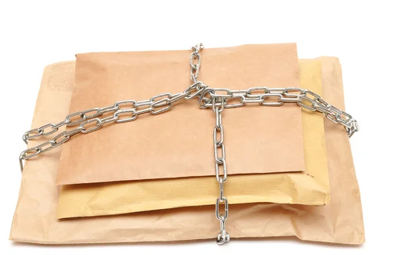 Parcel wrapped in a chain — Stock Photo, Image