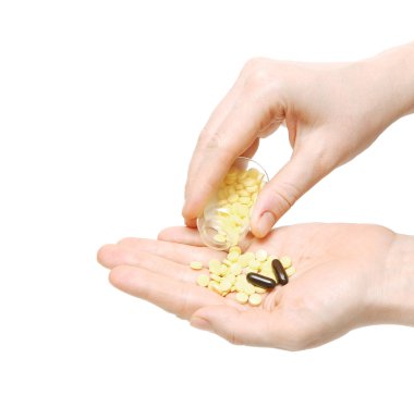 Closeup on woman's hands with pills and pill container clipart