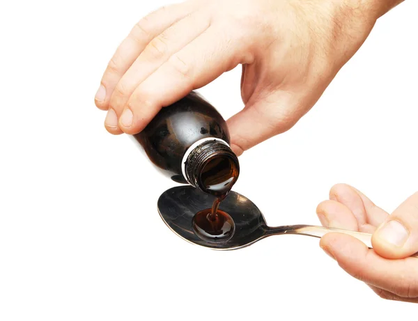 Cough syrup poured into a spoon — Stock Photo, Image