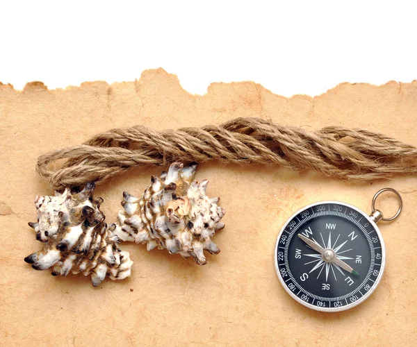 Seashell, kompass och rep — Stockfoto