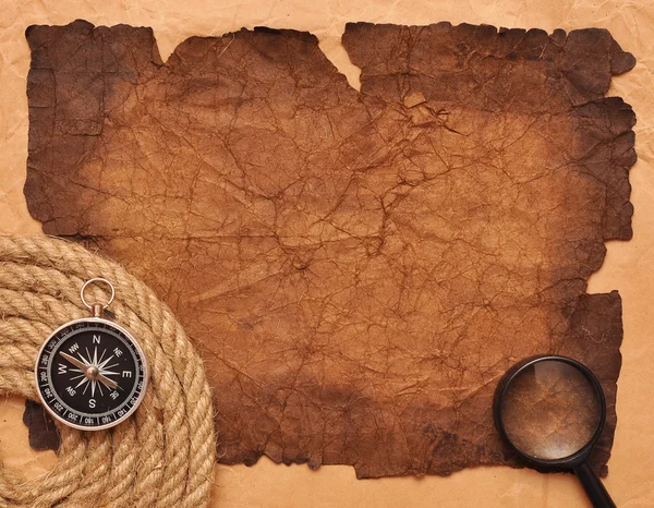 Rope coil with compass on old paper — Stock Photo, Image