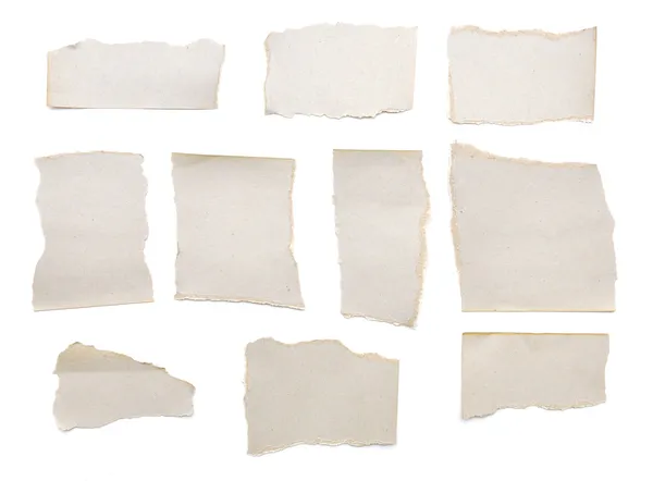 Collection of grey ripped pieces of paper — Stock Photo, Image