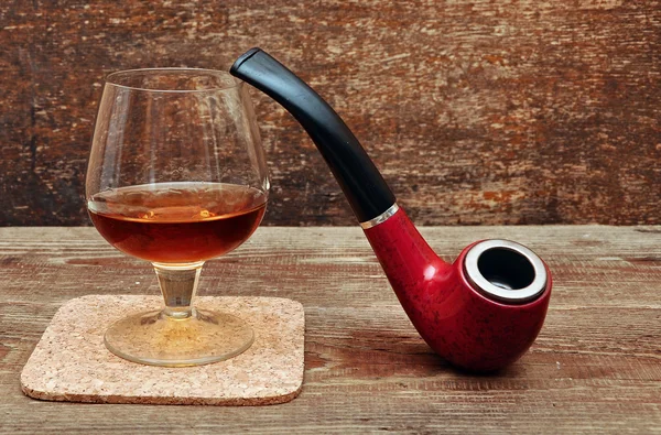 Pipe and glass of cognac — Stock Photo, Image