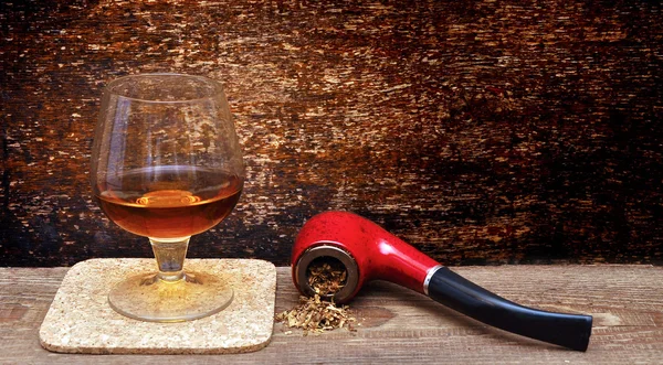 Pipe and glass of cognac — Stock Photo, Image