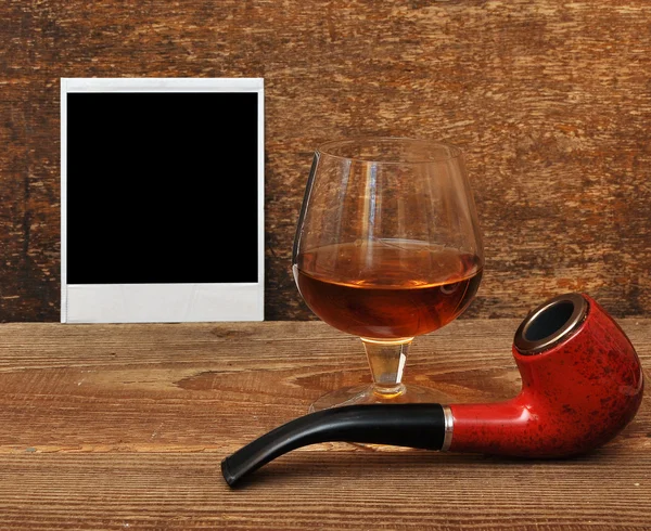 Old photo, pipe and glass of cognac — Stock Photo, Image