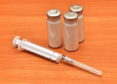 Medicine vials and syringe clipart