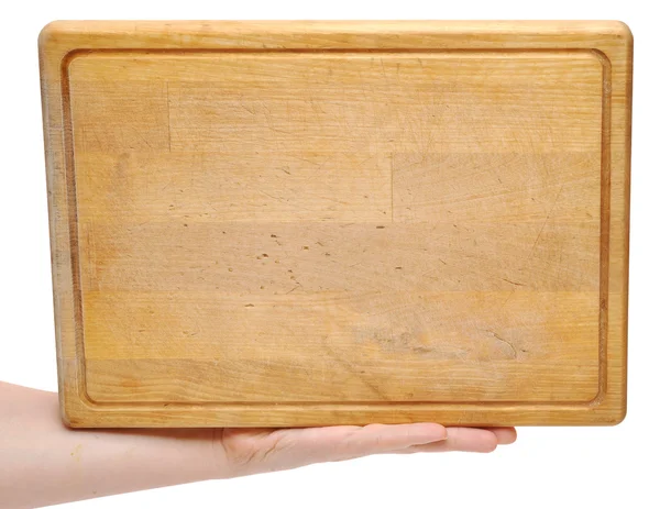 Em sua mão uma placa de madeira — Fotografia de Stock