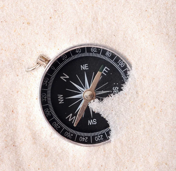 Compass in sand — Stock Photo, Image