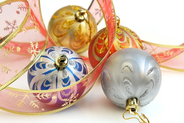 Isolated colorful Christmas baubles and pink ribbon — Stock Photo, Image