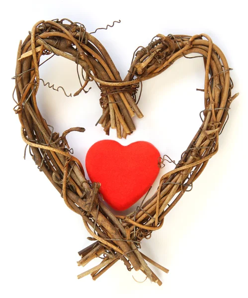Coeur rouge à l'intérieur coeur en bois — Photo
